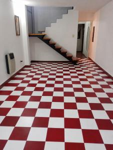 a room with a red and white checkered floor at Olloqui Dpto in Villa Mercedes