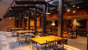 a row of tables and chairs in a restaurant at Andina Principal in Machu Picchu +5 photos