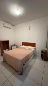 a bedroom with a large bed in a room at Beleleus Jeri in Jericoacoara