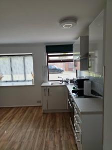 a kitchen with a sink and a counter top at Chilux in Rainham