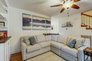 a living room with a couch and a ceiling fan at Rustic Retreat in Franklin