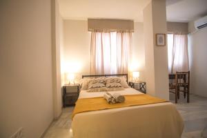 a bedroom with a bed with two towels on it at Forrent malaga in Málaga