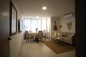 a living room with a couch and a table at Forrent malaga in Málaga