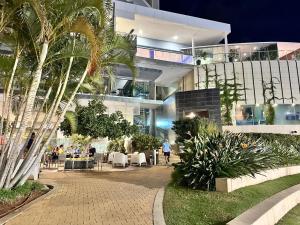 a building with a courtyard with tables and chairs at Rental Higueron Boutique Resort in Fuengirola