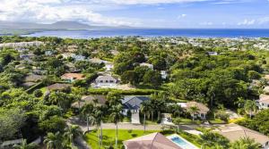an aerial view of a neighborhood with houses and the ocean at Hispaniola Residential - Villas & Apartments! in Sosúa