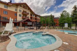a hot tub in a courtyard in front of a building at CS110 Copper Springs in Copper Mountain