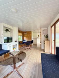 a living room with a table and chairs at Przystanek Natura in Gorczyca