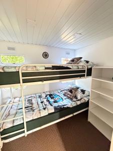 a room with two bunk beds in a house at Przystanek Natura in Gorczyca