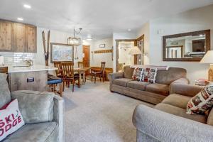 a living room with a couch and a table at CS110 Copper Springs in Copper Mountain