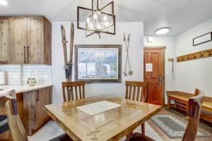 a kitchen and dining room with a wooden table and chairs at CS110 Copper Springs in Copper Mountain