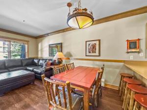 a living room with a table and a couch at CS129 Copper Springs in Copper Mountain +10 photos