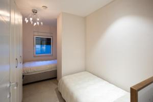a small bedroom with a bed and a window at Villa Eterna in Tarčin +31 photos
