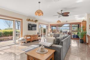 a living room with a couch and a table at Three Acres, Barossa Valley in Williamstown