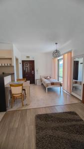 a living room with a couch and a table at Студио JASMIN in Tsarevo