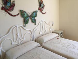 Postel nebo postele na pokoji v ubytování Apartamento Danmi y Janet