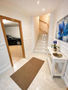 a hallway with a car parked in a garage at Casa Turística Mareira O Grove in O Grove