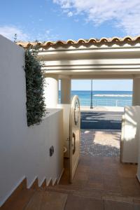 a bathroom in a house with a view of the ocean at Villa Kyma in Platána