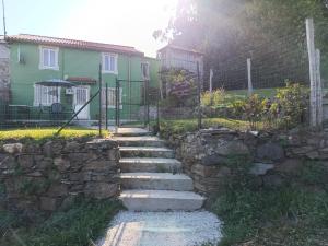 a stone path in front of a house at Casa en CEDEIRA in Cedeira