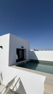 a house with a swimming pool on the roof at Avanel Private Pool Penthouse in Ronda