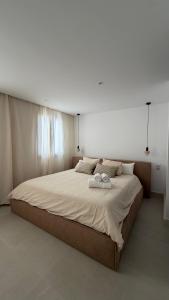a bedroom with a large bed with two towels on it at Avanel Private Pool Penthouse in Ronda +48 photos