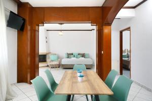 a dining room with a table and chairs at Solere Apartments in Limenaria