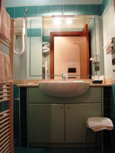 a bathroom with a sink and a mirror at Hotel Residence Due Mari in Marcellinara