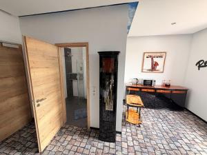 a room with a door and a table and a desk at Sleep Inn Hotel in Paderborn