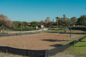 a tennis court in the middle of a park at Flow Datca Surf & Beach Hotel in Datca