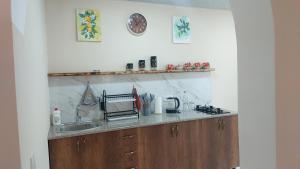 a kitchen with a sink and a counter top at Сабудара in Martvili