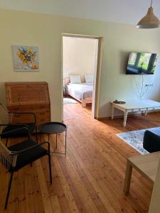 a living room with a couch and a table at Baumanis klasika in Valmiera