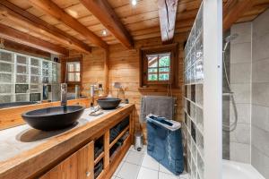 a bathroom with two sinks and a shower at Echyllo in Forville +27 photos