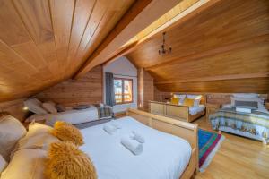 a large room with two beds and a couch at Le Stam in La Salle-les-Alpes +29 photos