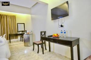 a living room with a table with fruit on it at Comfort Pyramids Inn in Cairo