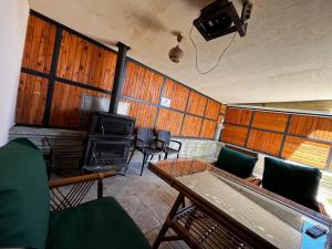 a living room with a table and a stove at Bungavilla in Atakum