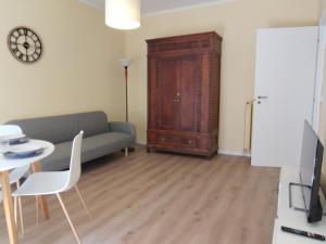 a living room with a couch and a table at casa marina in Pettenasco +11 photos