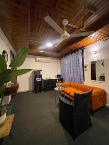 a living room with a couch and a table at Arrabella Masaki in Dar es Salaam
