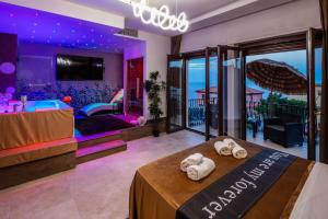 a hotel room with a bed with towels on it at Suite Apartment Taormina in Taormina