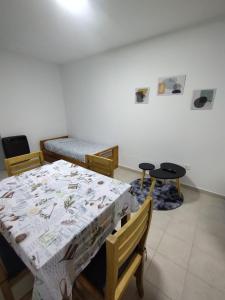a dining room with a table and chairs and a table and a table and chairs at WB1c in Puerto Madryn
