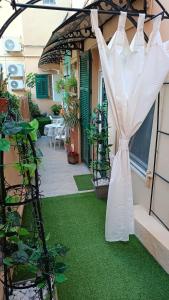 a wedding veil on a patio with green grass at Ribero's Home - Center - Quite Zone in Sanremo