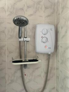 a hair dryer and a blow dryer on a wall at Charming Kintbury Cottage in Kintbury +38 photos