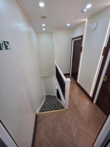 a staircase in a building with a stair case at Hayes Studios near Heathrow in Northolt
