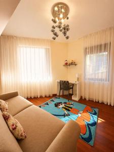 a living room with a couch and a table at Vista Marre Vidikovac in Budva +14 photos