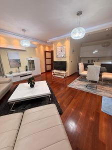 a living room with a couch and a table at Vista Marre Vidikovac in Budva
