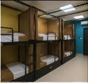 a group of four bunk beds in a room at GPT hostel in Hyderabad