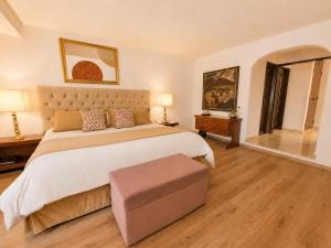 a large bedroom with a large bed and a table at Antara Hotel & Suites - Miraflores in Lima