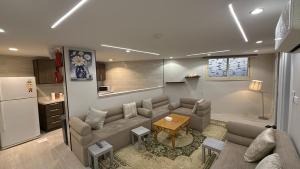 a living room with a couch and a table at الشروق in Al Baha