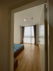 an empty room with a bed and a window at Luxury Apt l La Gare in Addis Ababa
