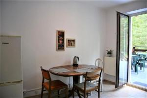 a dining room with a table and chairs at TanieSpanie in Legionowo +5 photos