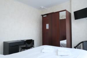 Postel nebo postele na pokoji v ubytování Hotel Carillon