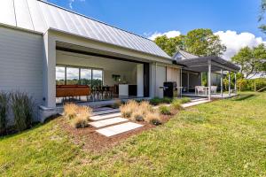a house with a patio and a yard at Valley View - Renovated Cottage New Addon and Pool in Copake